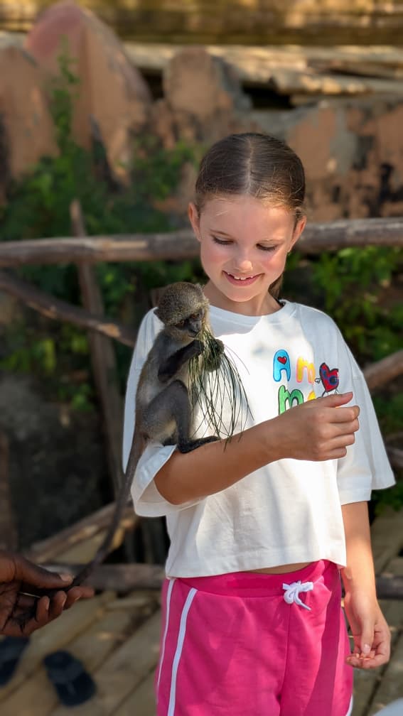 Prison Island Tours plays with monkey